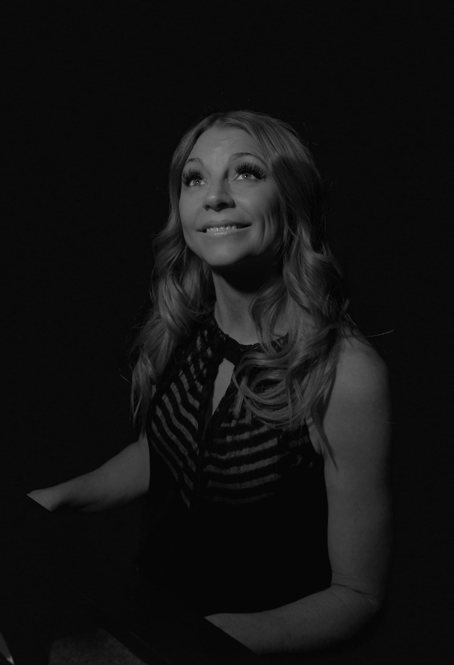 Lisa Apple — black and white portrait with warm smile