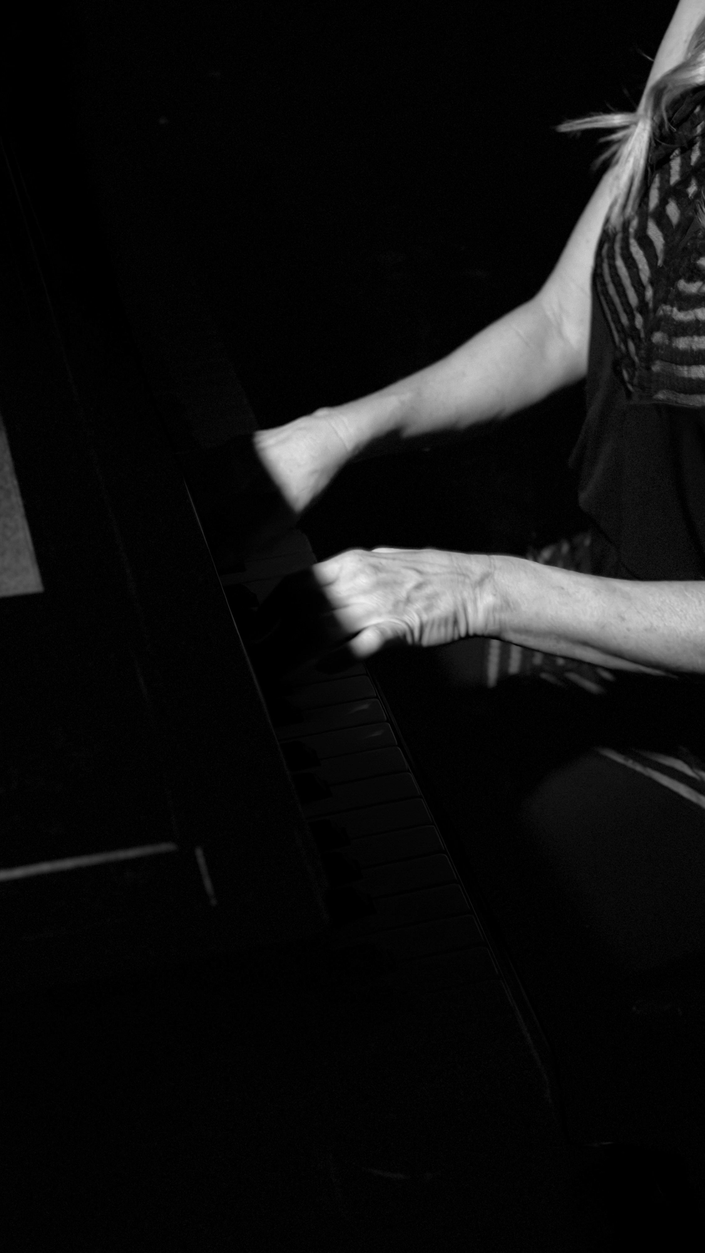 Hands in motion on piano keys